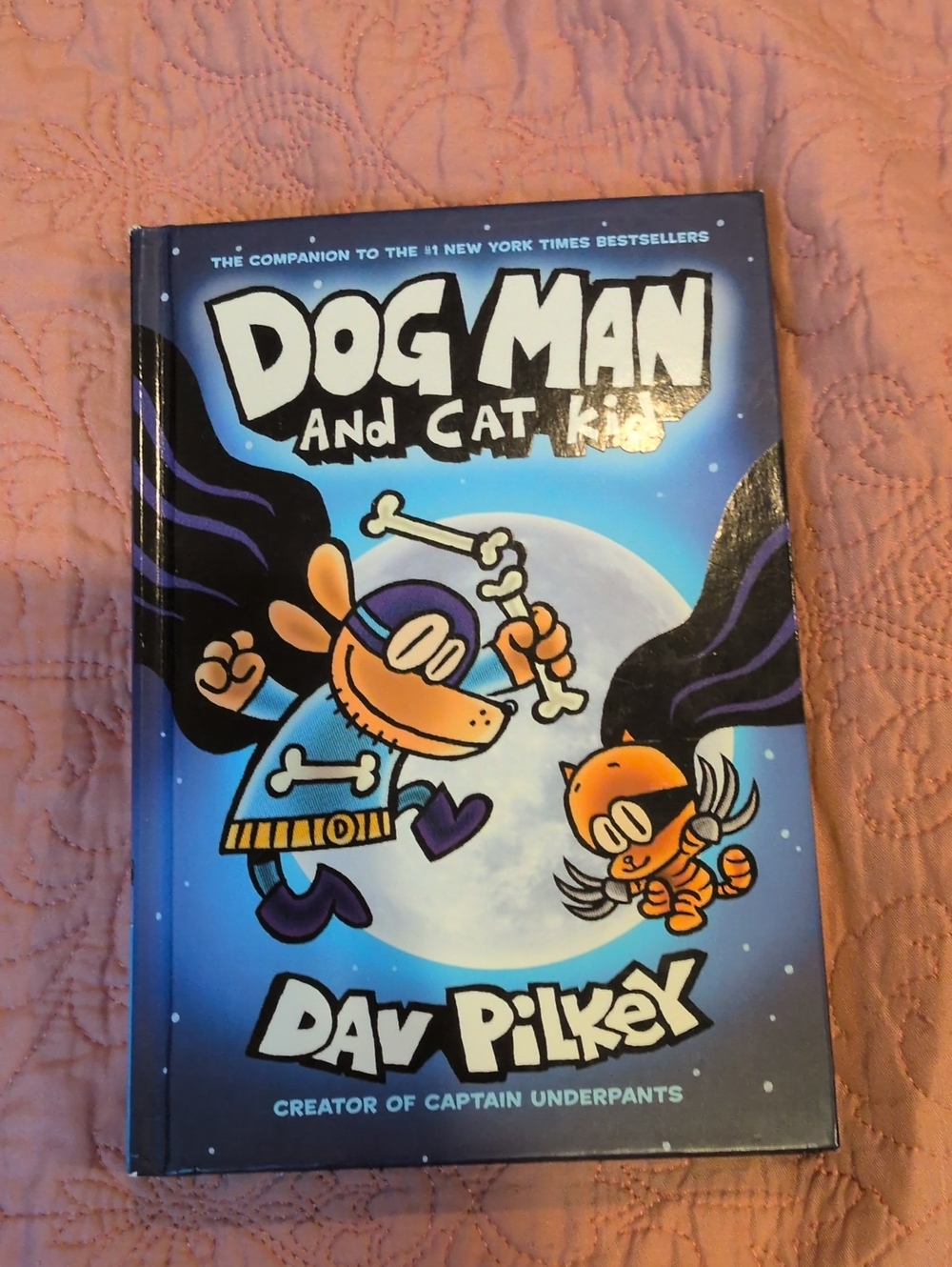 Dog book on blanket